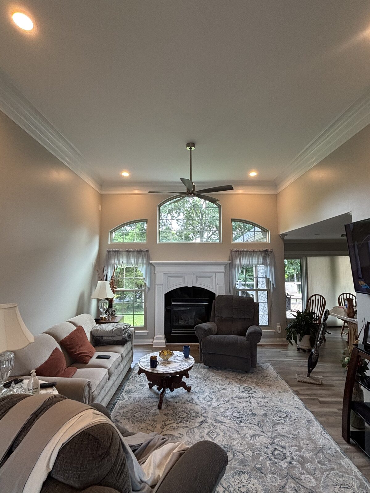 Living room with vaulted ceiling and fireplace after interior painting in Cedar Pointe, Corydon IN