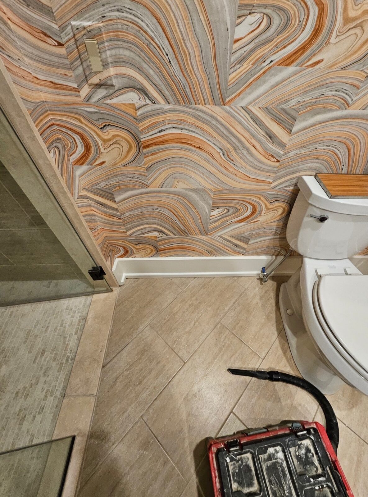 Bathroom with marble swirl print wallpaper installed in Louisville, KY