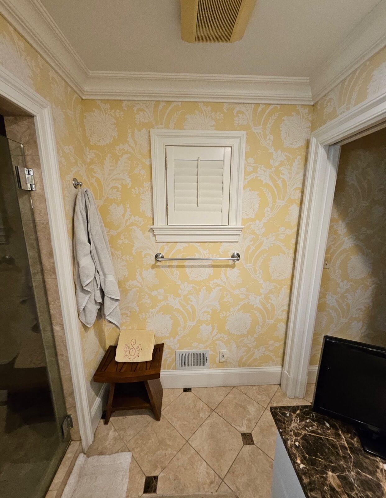 Bathroom with yellow damask floral wallpaper installed in Louisville, KY