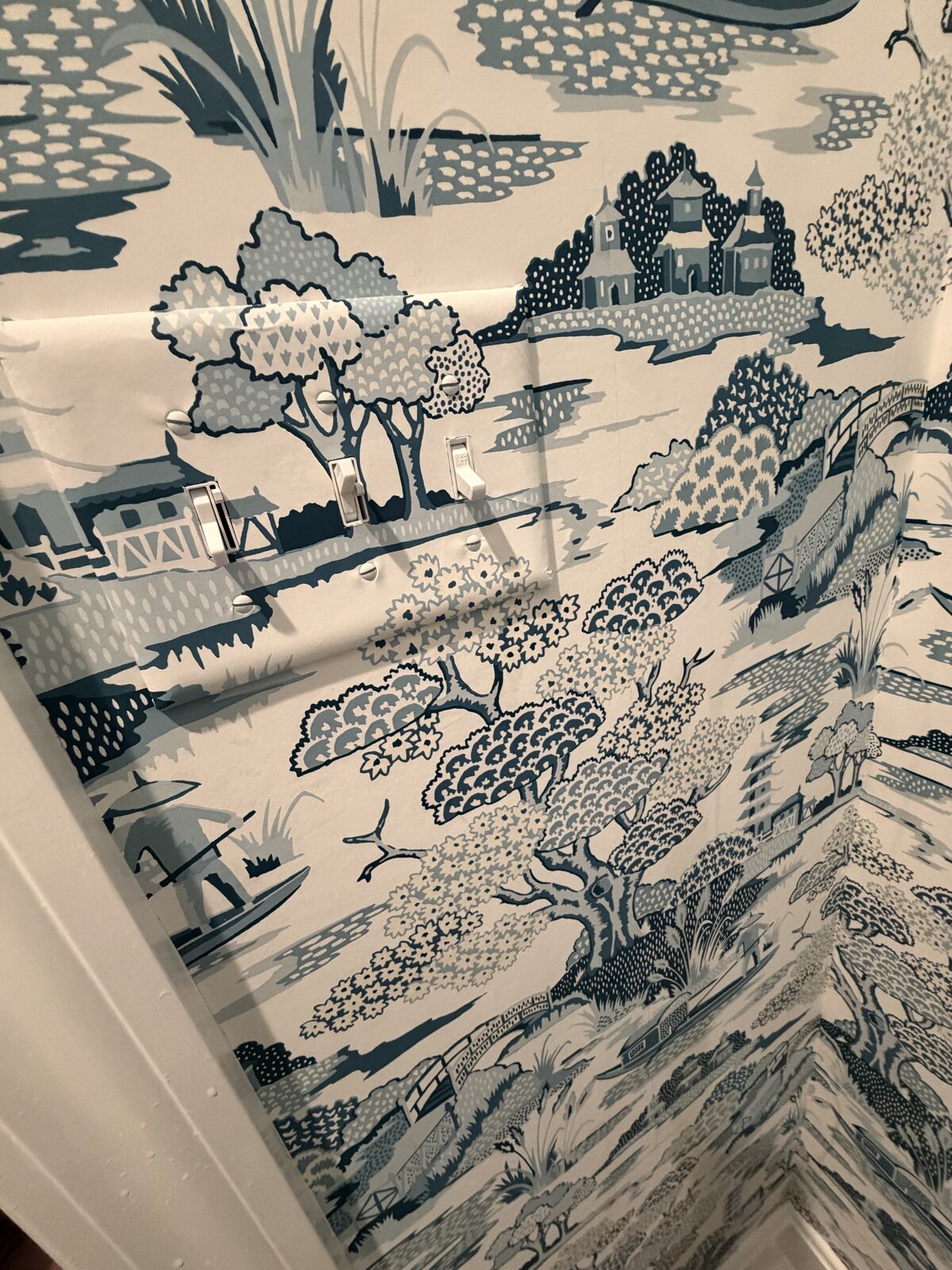 Detail of blue and white chinoiserie toile wallpaper installed in Louisville, KY