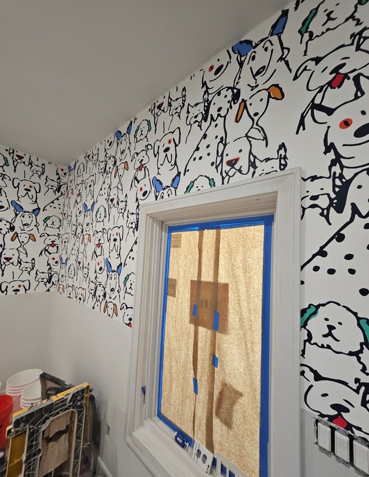 Kids room accent wall with playful dog print wallpaper installed in Louisville, KY