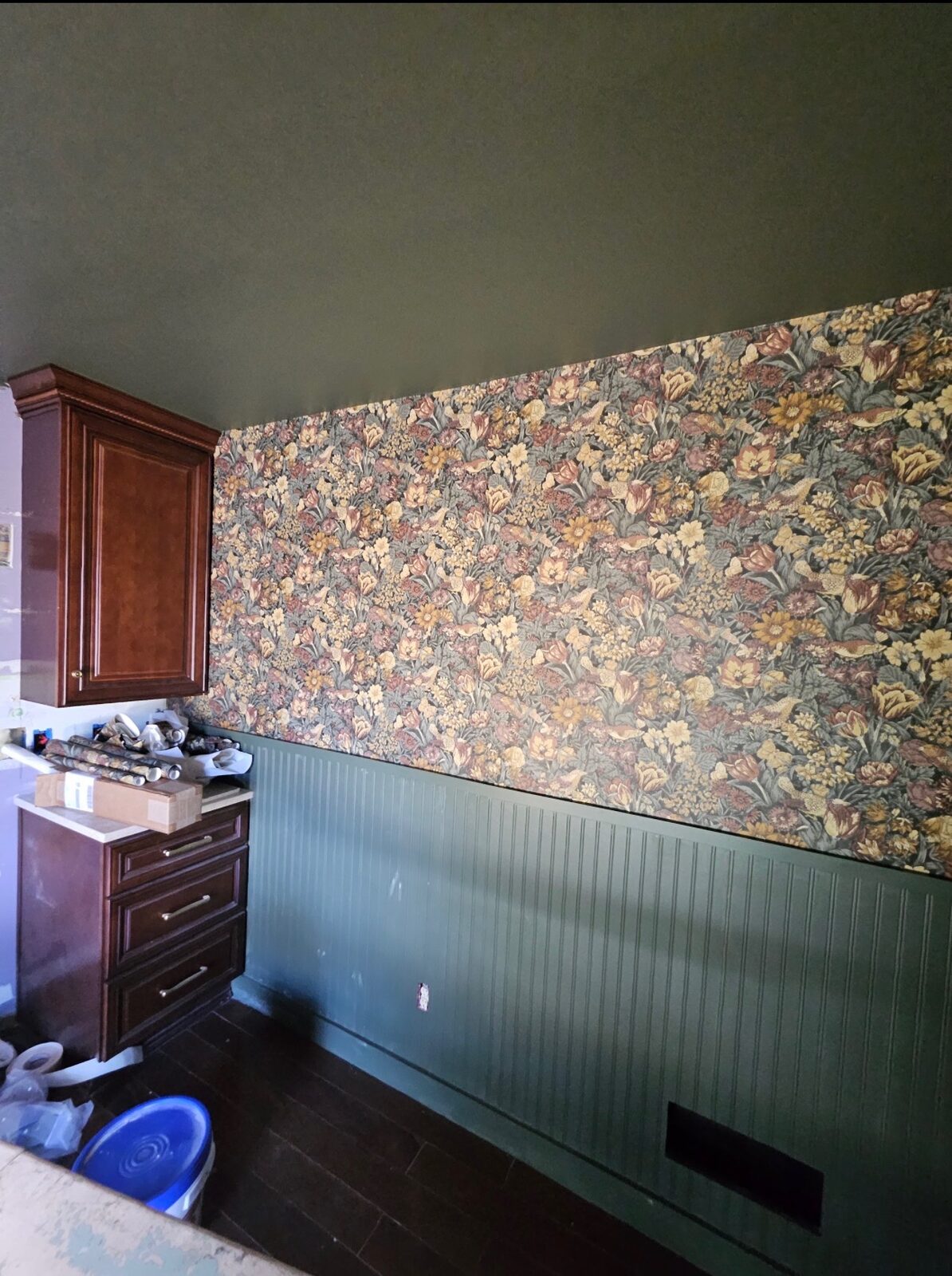 Kitchen accent wall with vintage floral wallpaper installed in Louisville, KY