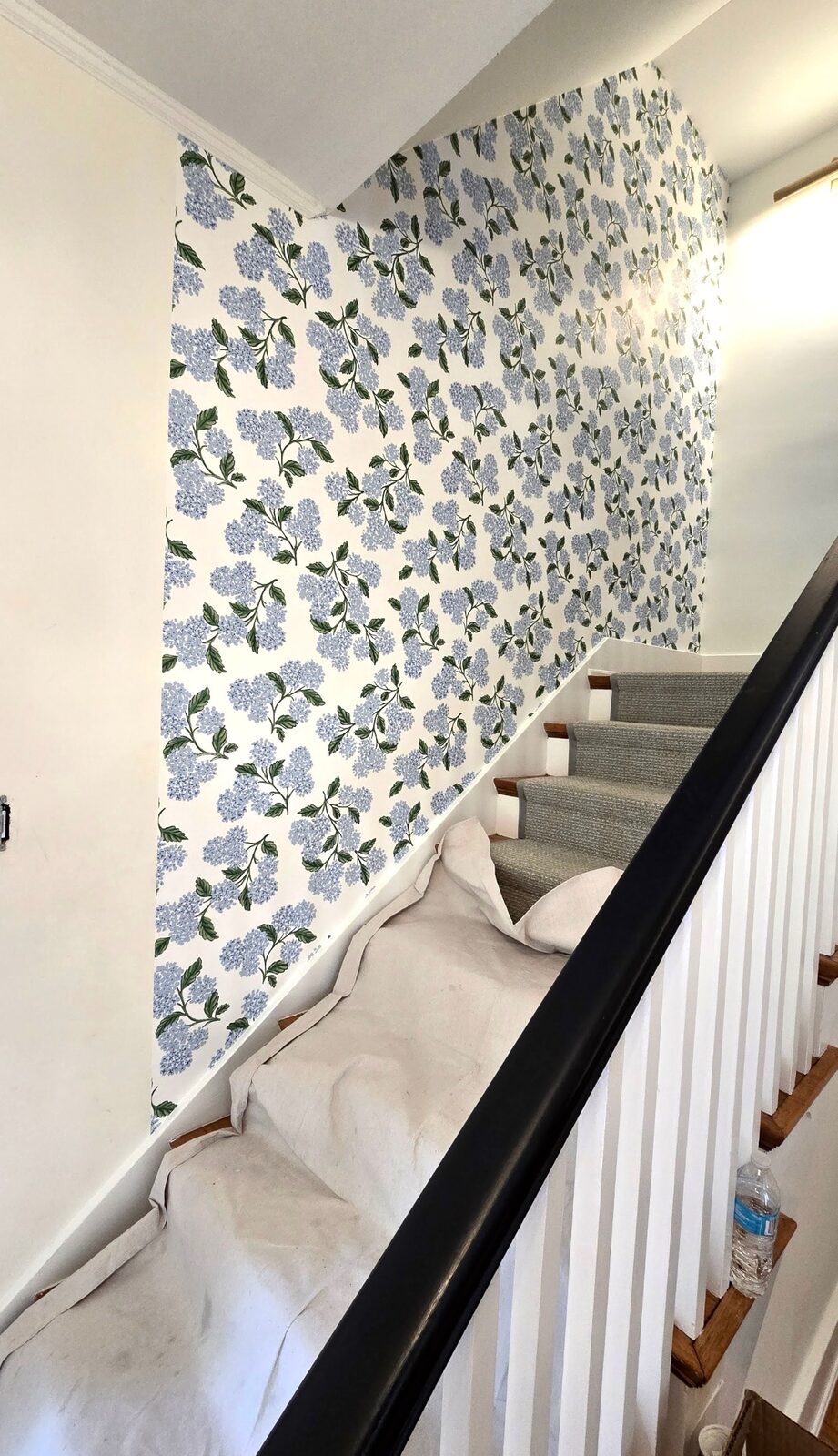 Stairwell with blue hydrangea floral wallpaper installed in Louisville, KY